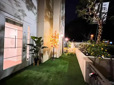 a yard with green grass and lights on a building at Beautiful 2 BD 3 Beds in Heart of Encino 105 in Encino