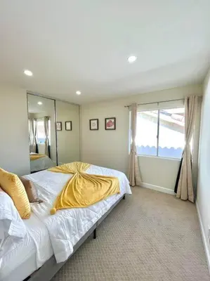 a bedroom with two beds and a large window at Family Paradise near Disneyland with Sparkling Pool in Del Prado Bolsa