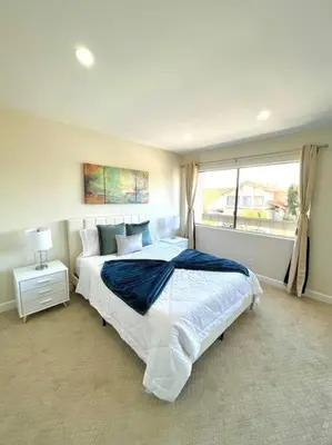 a bedroom with a large bed and a window at Family Paradise near Disneyland with Sparkling Pool in Del Prado Bolsa
