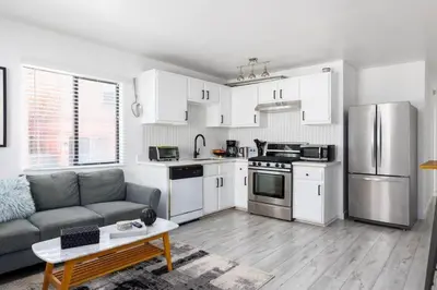 a living room with a couch and a kitchen at Sunny 1 Bedroom in the Heart of Venice Beach - #1 in Los Angeles