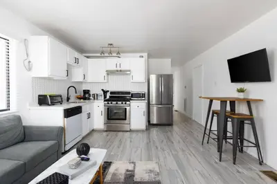 a living room with a couch and a kitchen at Sunny 1 Bedroom in the Heart of Venice Beach - #1 in Los Angeles