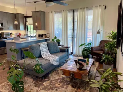 a living room with a couch and a table at Cozy Guesthouse with Rooftop Deck in Los Angeles