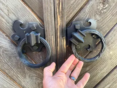 a hand is reaching for a lock on a wooden door at Cozy Guesthouse with Rooftop Deck in Los Angeles