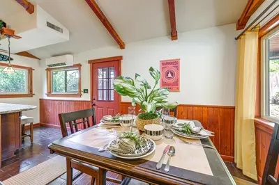 a dining room with a wooden table with plants on it at Idyllic Home in Kernville with Private Beach Access in Kernville