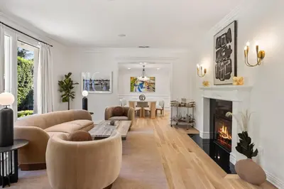 a living room with a couch and a fireplace at Belmont Beverly Hills by Stay Awhile Villas in Los Angeles