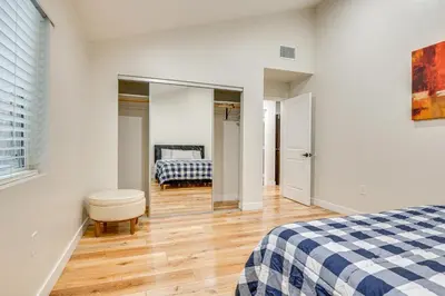 a white bedroom with a bed and a mirror at 10 Mi to Dtwn LA Cat-Friendly Rosemead Cottage in Rosemead
