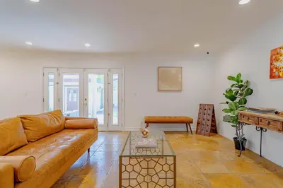 a living room with a couch and a table at Cozy Home with Pool and Jacuzzi Minutes from Universal Studios in Los Angeles