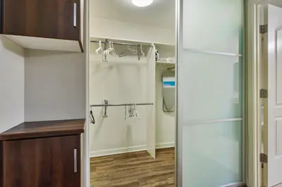 a walk in closet with a sliding glass door at Charming 1BD with Pool and Free Parking in Los Angeles