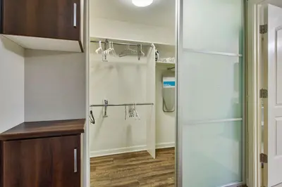 a bathroom with a closet with a glass door at Charming 1BD with Pool and Free Parking in Los Angeles