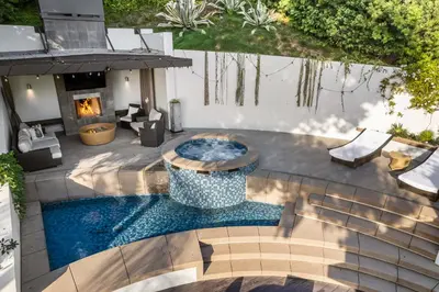 an overhead view of a backyard with a pool and a fireplace at West Hollywood Hills Jacuzzi and Beautiful View in Los Angeles