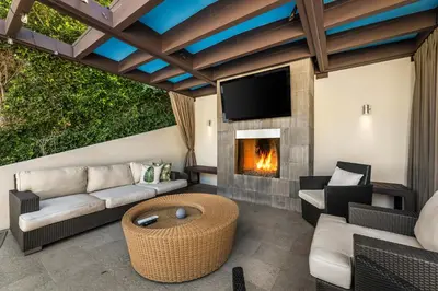 a living room with a couch and a fireplace at West Hollywood Hills Jacuzzi and Beautiful View in Los Angeles