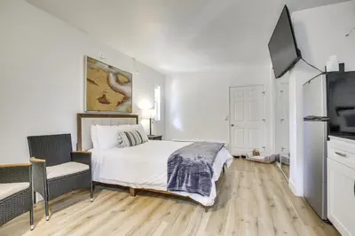 a bedroom with a bed and a flat screen tv at 2 Mi to Water Lake Arrowhead Studio in Lake Arrowhead