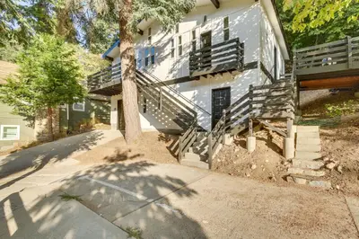 a house with a tree in front of it at 2 Mi to Water Lake Arrowhead Studio in Lake Arrowhead