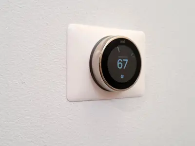 a lightswitch with a clock on a wall at Hollywood Luxury Retreat I Pool Views I Jacuzzi I Fitness Center I Free Parking! in Los Angeles