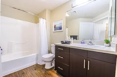 a bathroom with a sink and a toilet and a tub at Marina del Rey 2BR - Near LAX, Beach & Dining in Los Angeles