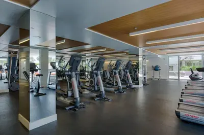a gym with rows of exercise bikes and treadmills at Marina del Rey 2BR - Near LAX, Beach & Dining in Los Angeles
