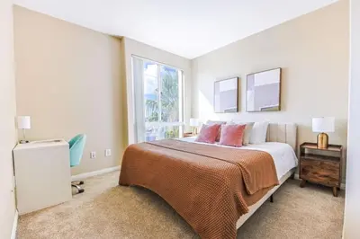 a bedroom with a large bed and a window at Marina del Rey 2BR - Near LAX, Beach & Dining in Los Angeles