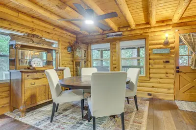 a dining room with a table and chairs at Cabin about 1 Mi to Lake Gregory and Hiking! in Crestline