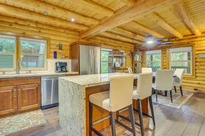 a kitchen with a table and chairs in a cabin at Cabin about 1 Mi to Lake Gregory and Hiking! in Crestline