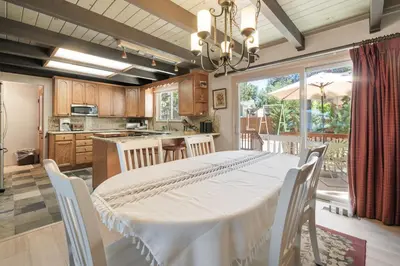 a kitchen and dining room with a table and chairs at Sunset Spectacular - Multi-level haven with water views! Incredible for 4th of July! in Big Bear Lake