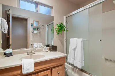 a bathroom with a sink and a shower at Sunset Spectacular - Multi-level haven with water views! Incredible for 4th of July! in Big Bear Lake