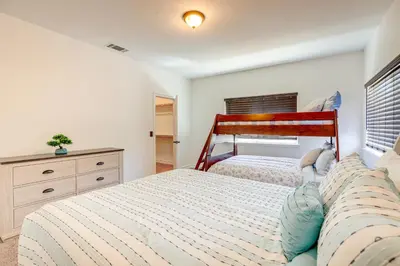 a bedroom with two beds and a dresser at Hesperia Home Near Mojave River and Hiking Trails! in Hesperia