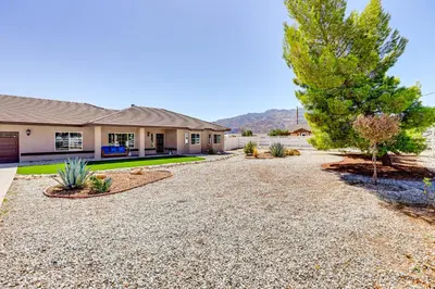 a home with a gravel driveway at Hesperia Home Near Mojave River and Hiking Trails! in Hesperia