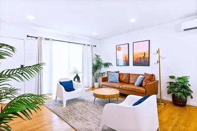 a living room with a couch and two chairs at Spacious 3BR Home Near Disneyland & Knotts Berry Farm in Fullerton