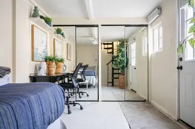 a bedroom with a bed and a desk and a table at 2min2Beach, Netflix, AC, WD,15min2LAX, Fast Wifi in Hermosa Beach