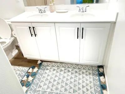 a bathroom with a white sink and a toilet at Modern Desert Gem, Boho Retreat 2 Living Rooms in Hesperia