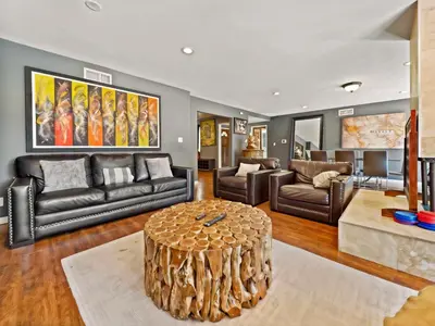 a living room with leather furniture and a coffee table at Retreat with Pool in Los Angeles
