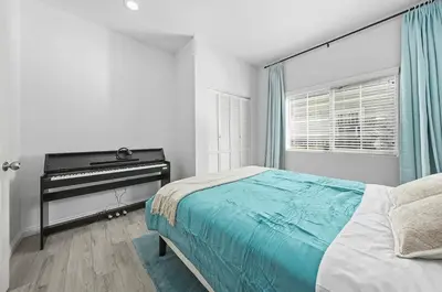 a bedroom with a bed and a piano at Great Location Oasis w Huge Backyard Near DTLA ,USC ,Ktown in Los Angeles
