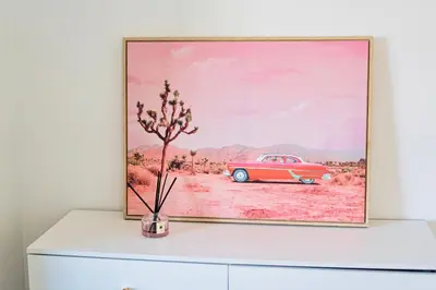 a painting of a red car on top of a dresser at Great Location Oasis w Huge Backyard Near DTLA ,USC ,Ktown in Los Angeles