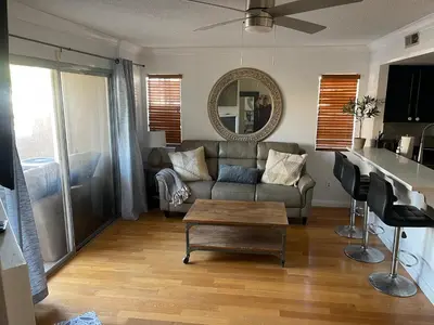 a living room with a couch and a table at Central LA GATED Community 4 beds home in Commerce