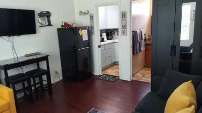 a kitchen with a refrigerator and a table in a room at Guestsuite in wittier in Whittier