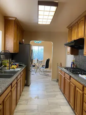 a kitchen with a sink and a refrigerator at Sunrise Room 1 guest only near DTLA in San Gabriel
