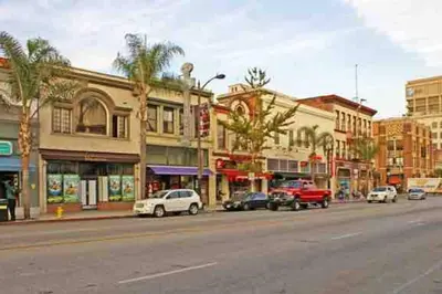 a city street with cars parked in front of buildings at Sunrise Room 1 guest only near DTLA in San Gabriel