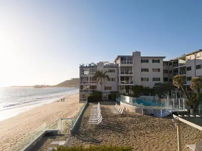 a view of a beach with buildings and condos at Aquamarine Best View in Malibu by Stay Awhile Villas in Malibu Beach