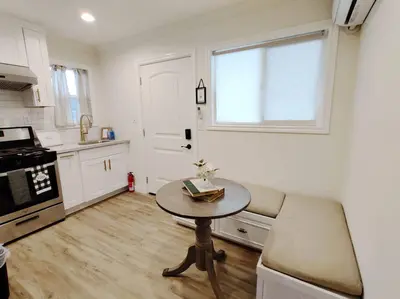 a kitchen with a table and a window and a table at Cozy 2B1B Guest House with Private Entrance and Parking in El Monte