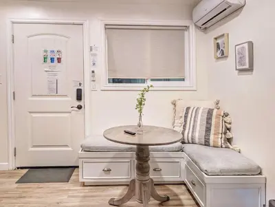 a room with a table and a chair and a door at Cozy 2B1B Guest House with Private Entrance and Parking in El Monte
