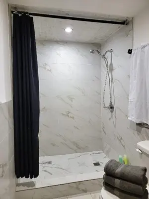 a bathroom with a shower with a shower curtain at Private guest studio 5 minutes to Rodeo Drive and in great area in Los Angeles
