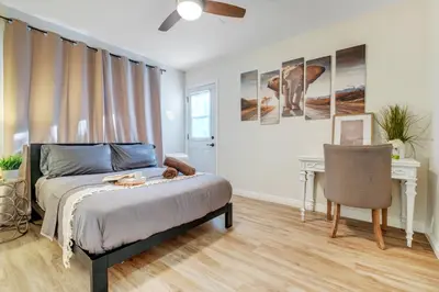 a bedroom with a bed and a desk and a chair at Spacious 3BR Modern Home in LA Perfect for Family in El Monte