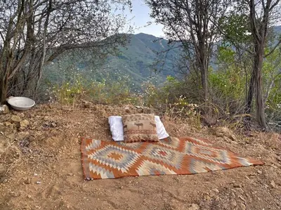 a bed sitting on top of a hill with a view at Topanga Panoramic View Loft with Trails & Creeks in Topanga