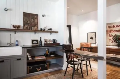 a kitchen with two chairs and a table in a room at Hotel Covell in Los Angeles