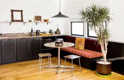 a kitchen with a couch and a table and chairs at Hotel Covell in Los Angeles