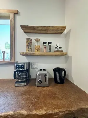 a kitchen counter with a toaster and a coffee maker at Vacation House in Ontario - Two Bedroom Brand New and Hand Made Furniture in Ontario