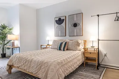 a bedroom with a bed and two night stands at Stylish 2BDR & 2BTH - 15 mins walk to the beach! in Los Angeles
