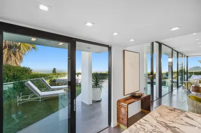 an open living room with sliding glass doors at The Elvis Villa by Stay Awhile Villas in Los Angeles