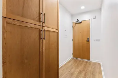 a room with two wooden doors and a hallway at Amazing studio in SM Promenade! Free parking! in Los Angeles