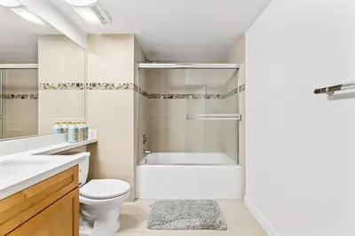 a bathroom with a tub and a toilet and a sink at Amazing studio in SM Promenade! Free parking! in Los Angeles